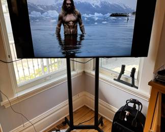 Samsung 55” UHD 4K Ultra SMART TV with rolling tv stand. This comes with ROKU TV