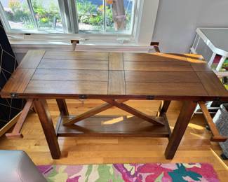 Space saving console that can fold open to a small dining table 