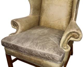 A Distressed Leather Nailhead Trim Wingback Chair
