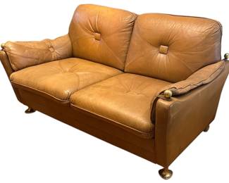 A Mid Century Italian Leather and Brass Sofa
