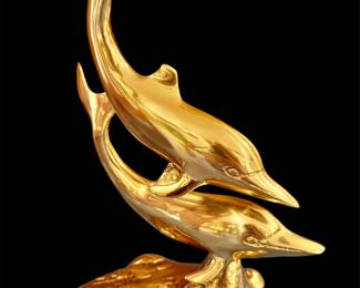 Large brass dolphins