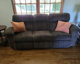 Upholstered sofa, reclines on 2 ends
