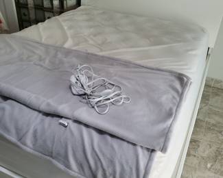 Queen white headboard and platform frame. Mattress high-end.