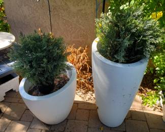 White composite planters with faux cedar bushes