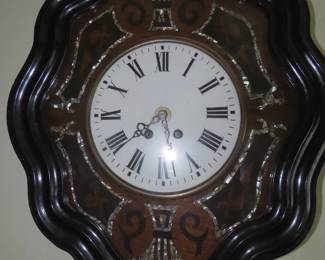 Antique clock with abilone inlays.