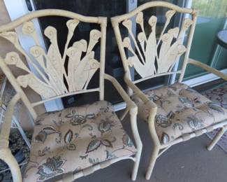 Two patio chairs with cushions
