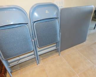 Like new games table with four folding chairs.