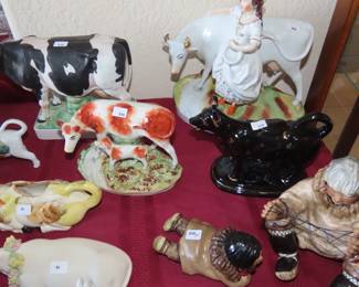 Collection of cows, Delft, Lladro, Germany, Japan, England, porcelain, bisque some are milk jugs some are ornaments.