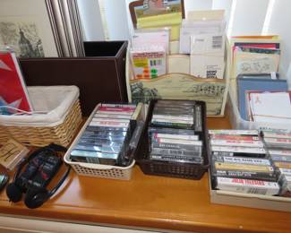 Cds, cassettes, office supplies, storage baskets.
