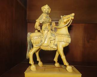 Bone like Asian warrior figure.