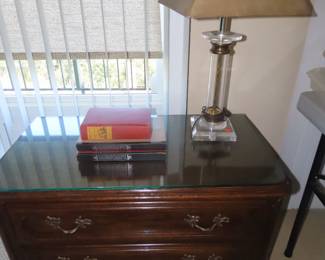 Two drawer Davis chest with glasstop and table lamp.