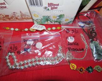 Collection of "Lilliput Lane" cottages, faux orchids, candle sticks, miniature clocks, jewelry and semi precious stones.