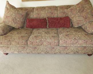 Paisley patterned comfy sofa and cushions.