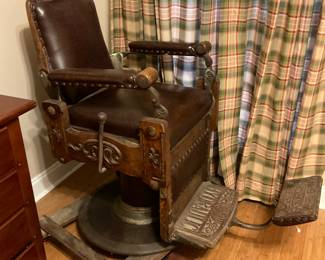 Hydraulic Barber Chair in great condition shown sitting on a dolly for an easy move