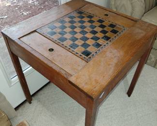 Chess table with 2 storage sections for player pieces.