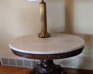 Victorian-era marble-top parlor table with carved wooden base.  L- 37 in.  W- 29 in.   H-29 in.