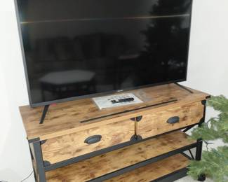 L- 48 in.    W- 18.5 in.   H-28.5  in.  Wood and metal console/tv stand with wheels.