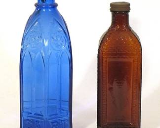 Colored glass bottles, including a Carter cobalt cathedral ink