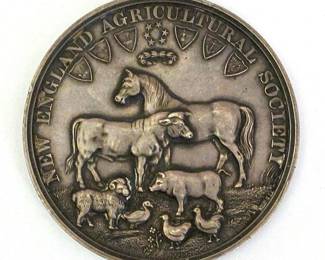 Silver medal awarded by the New England Agricultural Society to Wallace P. Mack, 1884