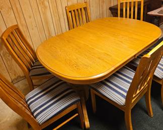 table with 6 cushioned chairs
