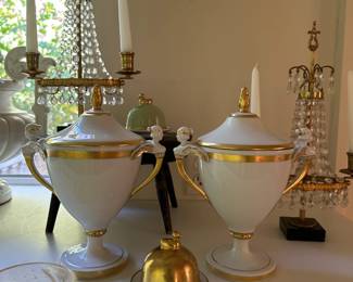 Pr of KPM white and gold covered urns in neoclassical style. Pr of small Legle Limoges, green and gold, individual butter dishes with a bird handle. 