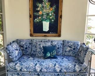 Front view of parcel-gilt day bed upholstered in blue and white and 'Evening Bouquet' by Tony Curtis (1925 - 2010). 