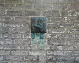 'Mutter Schützt ihr Kind II' by Kathe Kollwitz (1867 - 1945). Bronze with verdigris patina. 8" Sq.