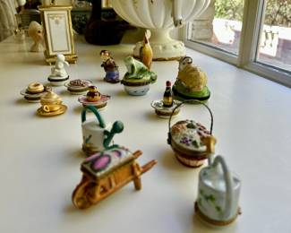 Collection of hand-painted Limoges petit mains boxes. Many garden, animal, and food themed.