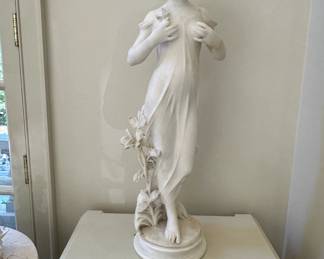 "Woman Holding Flowers to her Breast," by Raffaele Romanelli (1856-1928) marble.