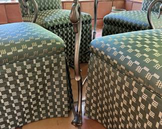 Detail of garden's room glass-top dinette table with swans as legs