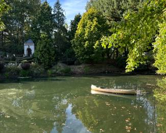 View of the pond with golden canoe