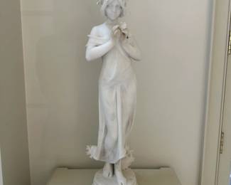 "Woman Holding Flowers," by Raffaele Romanelli (1856-1928) marble,