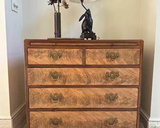 A five drawer chest with burled drawers.