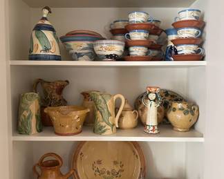 Multiple pieces of pottery, including parcial dinner sets, purchased in Provence.