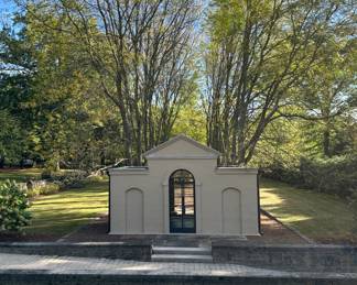 Neoclassical small building located in one of the formal gardens.