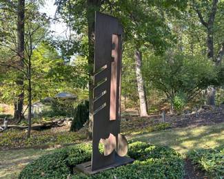 Side view of 'The Conductor' by Jay Lefkowitz. Corten Steel. 97"H x 37.5"W x 17'D