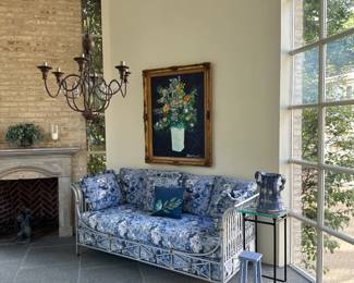 Side view of parcel-gilt day bed upholstered in blue and white and 'Evening Bouquet' by Tony Curtis (1925 - 2010). 