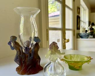 Collection of pâte de verre Daum Nancy pieces. Pictured are a vase, a perfume bottle, and a bowl.