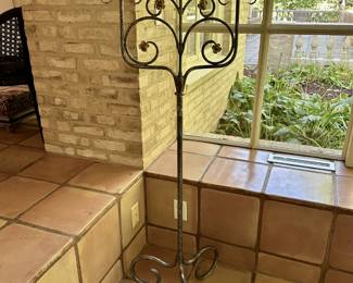 Parcel gilt wrought iron floor candelabrum with a silvered finish. 