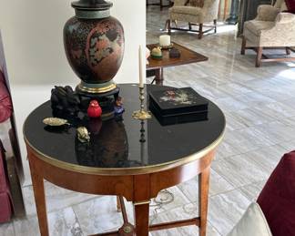 Circular fruitwood table with black composite top, 20th century