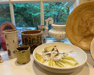 Examples from an extensive collection of large pottery bowls, canisters, and platers hand-painted by Carlo Marchiori, Italy (b. 1937).