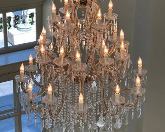 An impressive crystal and dore bronze chandelier. Two available for sale.