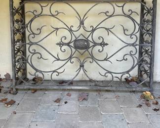 Narrow wrought iron console from the chapel. 