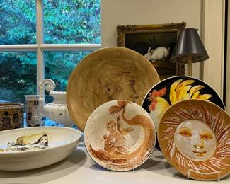 Examples from an extensive collection of large pottery bowls, canisters, and platers hand-painted by Carlo Marchiori, Italy (b. 1937).