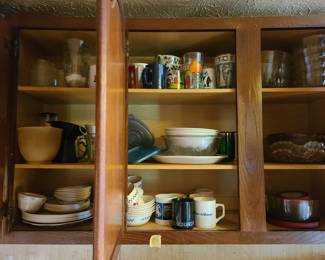 contents of cabinet, glassware, mugs, plates