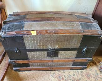 Antique steamer trunk with art inside