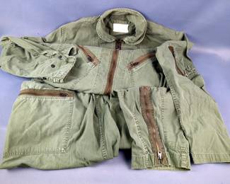 Military Uniform, Includes US Military Flying Coveralls, US Air Force Leather Cap And Glove, Air Service Leather Goggles, WWII Winter Jacket With Holes And Paint Stain, US And Foreign Military Caps, And Web Belts