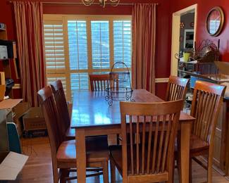Six-seat bar height dining room table with leaf.