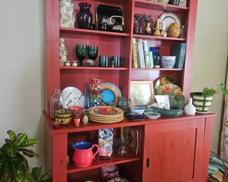 Gorgeous red display/storage cabinet! Lots of beautiful home decor