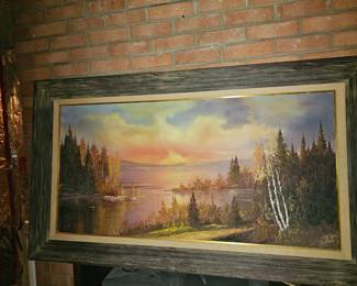 Large over-the-sofa picture in rustic frame